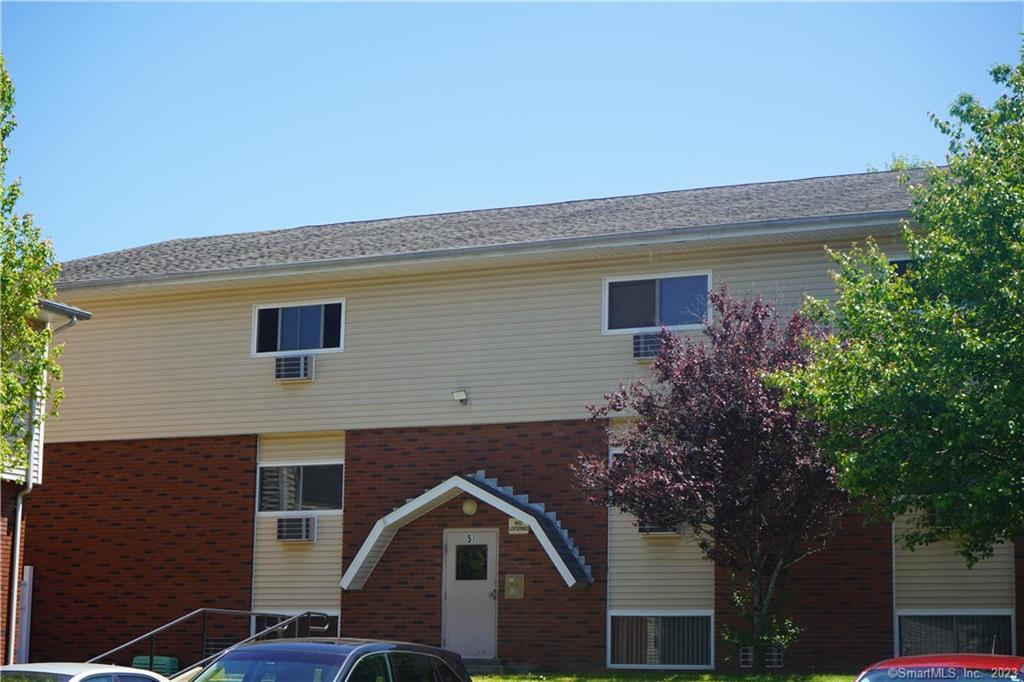 a front view of a house with yard