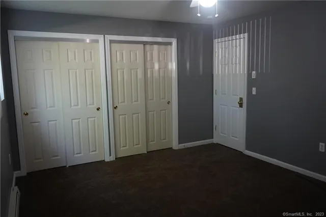an empty room with closet area