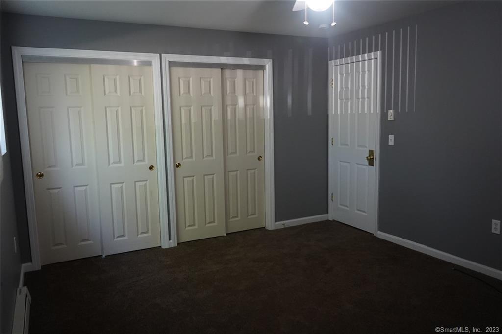57 Glade Street, Unit A2 West Haven, CT 06516 - Photo 14 of 18 an empty room with closet area