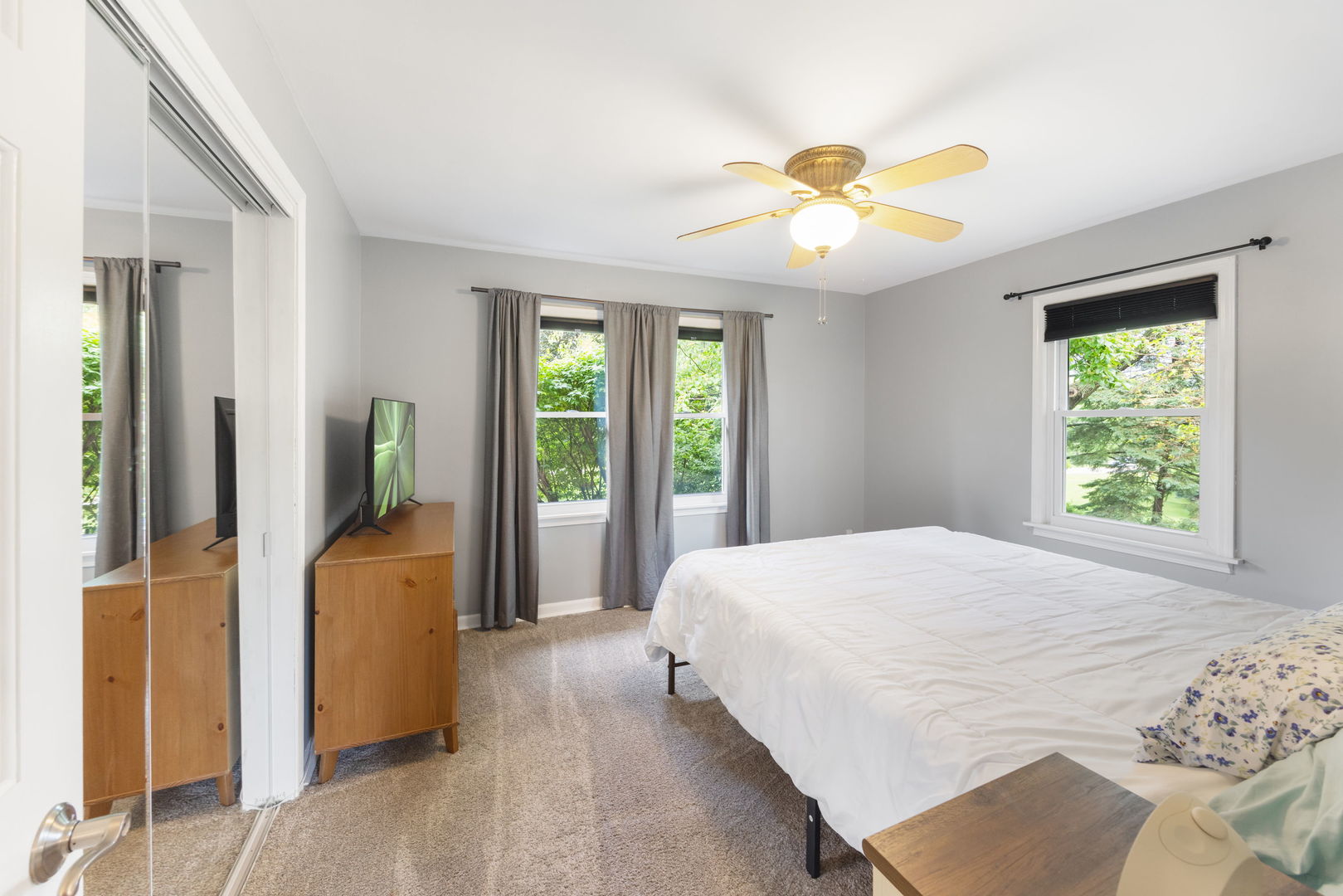 4N285 LaFox Road St. Charles, IL 60175 - Photo 10 of 17 a bedroom with a bed and a chandelier
