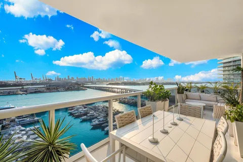 a view of swimming pool with seating space