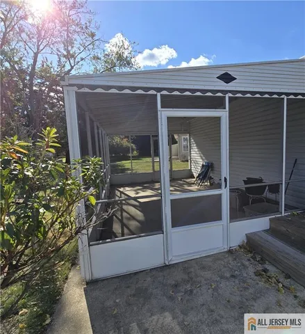 a view of backyard with cabin