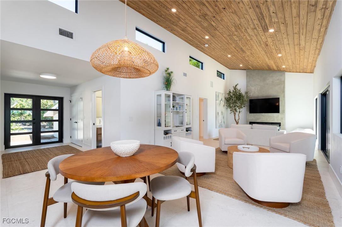 5801 Sanibel Captiva Road Sanibel, FL 33957 - Photo 1 of 45 a view of a dining room with furniture and window