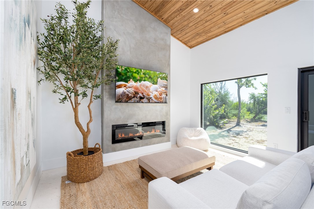 5801 Sanibel Captiva Road Sanibel, FL 33957 - Photo 16 of 45 a living room with furniture and a potted plant