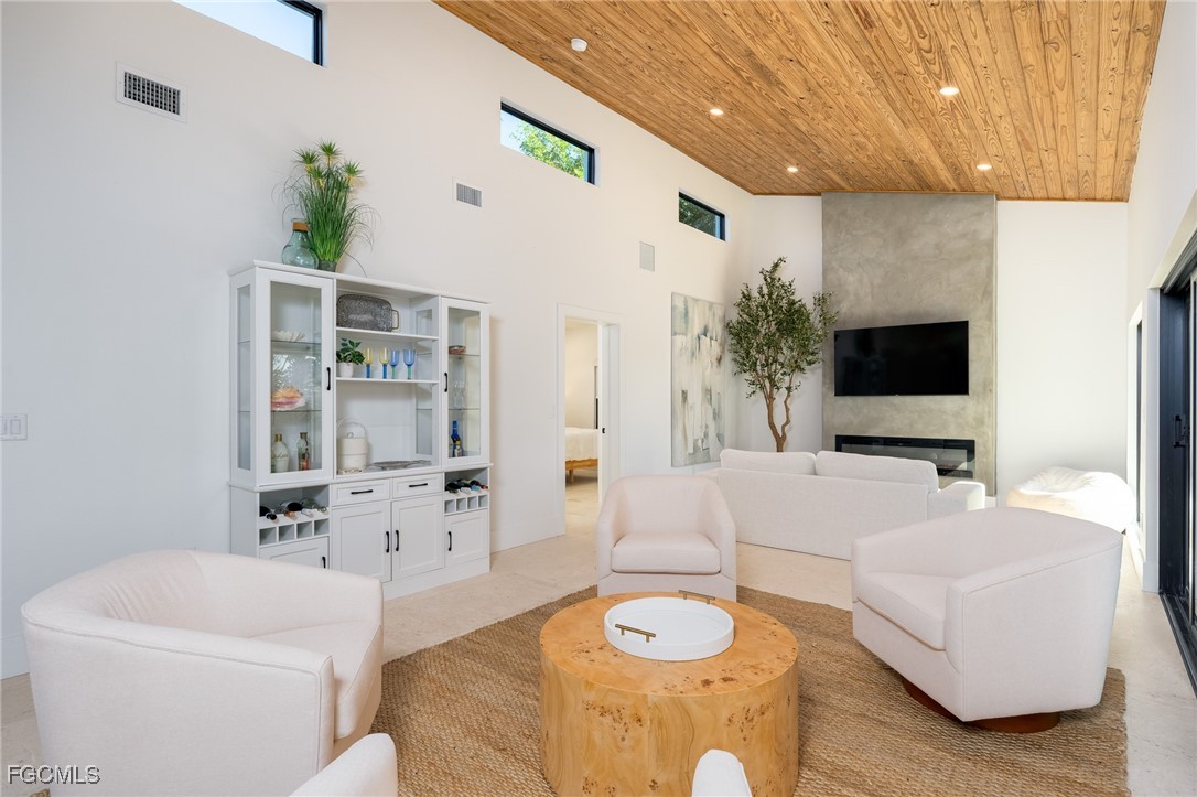 5801 Sanibel Captiva Road Sanibel, FL 33957 - Photo 19 of 45 a living room with furniture and a flat screen tv