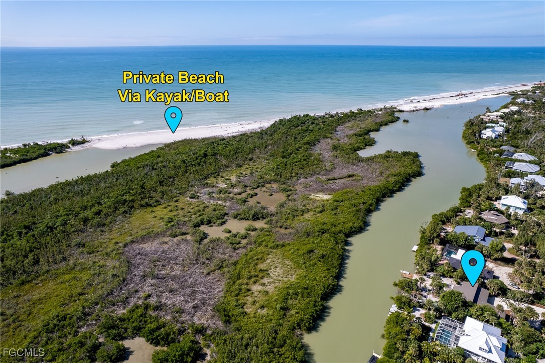 5801 Sanibel Captiva Road Sanibel, FL 33957 - Photo 2 of 45 a view of a lake with beach and ocean view
