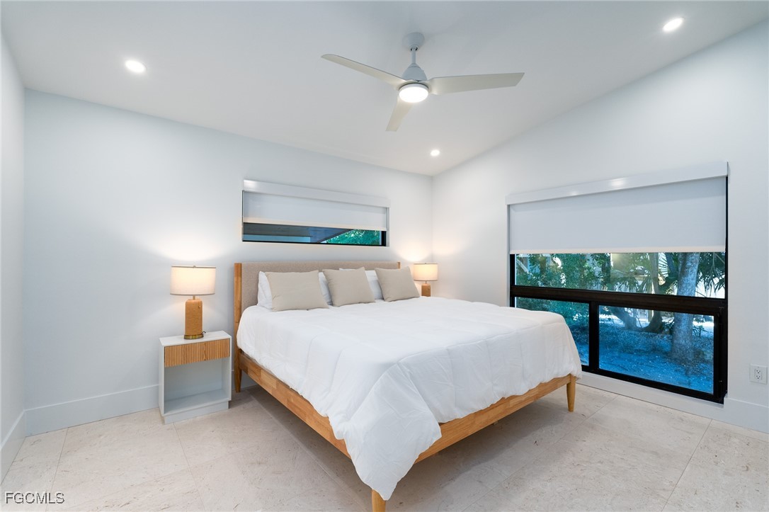 5801 Sanibel Captiva Road Sanibel, FL 33957 - Photo 24 of 45 a bedroom with a bed and window