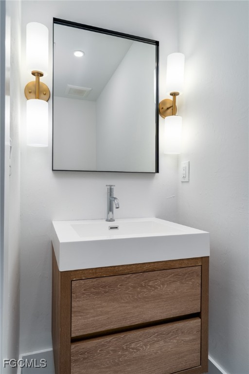 5801 Sanibel Captiva Road Sanibel, FL 33957 - Photo 30 of 45 a bathroom with a sink and a mirror