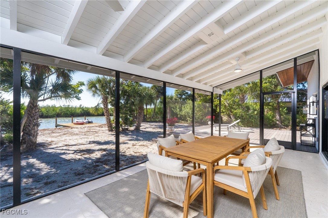 5801 Sanibel Captiva Road Sanibel, FL 33957 - Photo 32 of 45 a view of a patio with a table chairs and a table