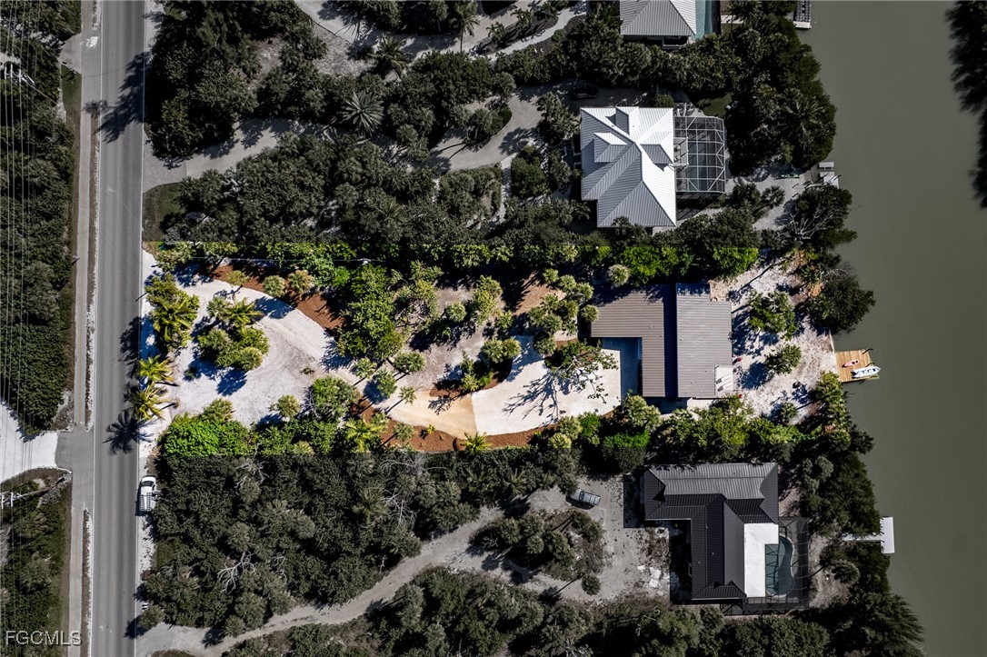 5801 Sanibel Captiva Road Sanibel, FL 33957 - Photo 45 of 45 an aerial view of a house with a yard and garden space