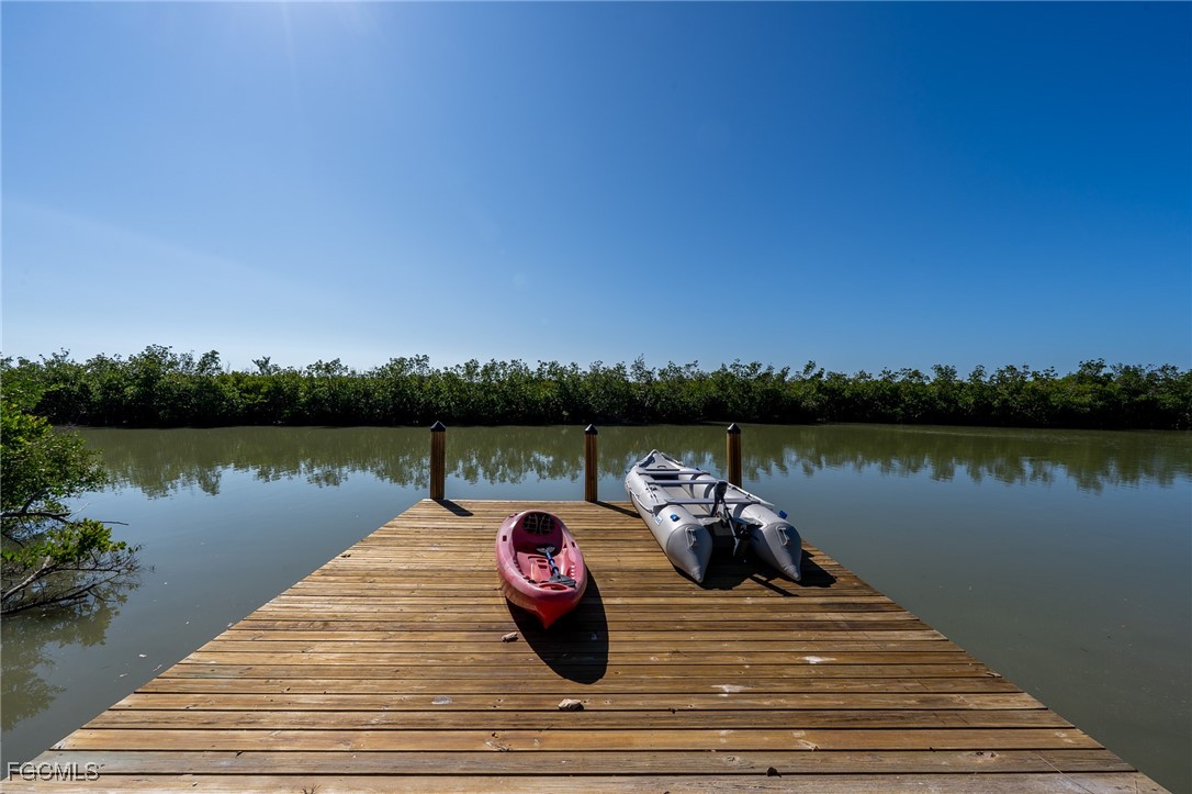 5801 Sanibel Captiva Road Sanibel, FL 33957 - Photo 10 of 45 a wooden floor and lake view
