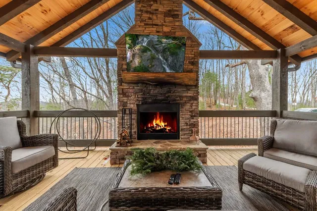 a view of a chairs and table in the balcony
