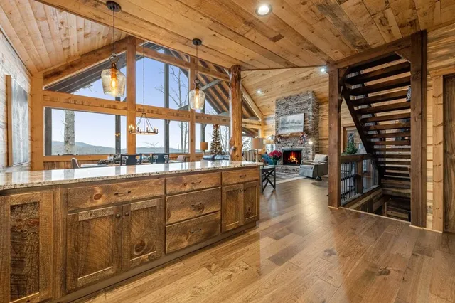 a view of a dining room with furniture and windows