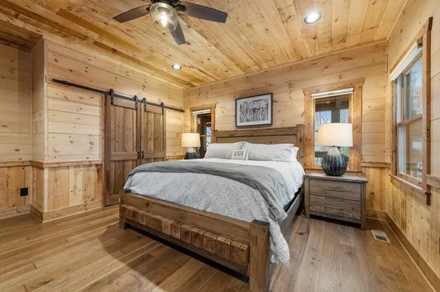 a view of a balcony with wooden floor and door