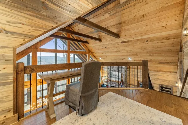 a view of a patio with a table and chairs