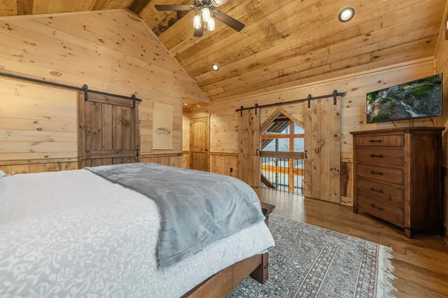 a living room with furniture ceiling fan and a rug