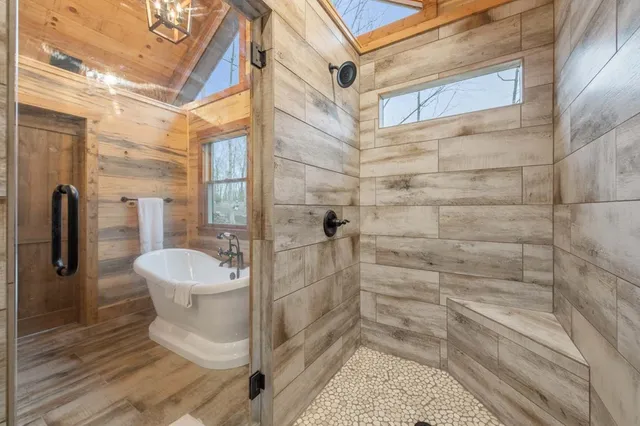 a bed sitting in a room next to a window