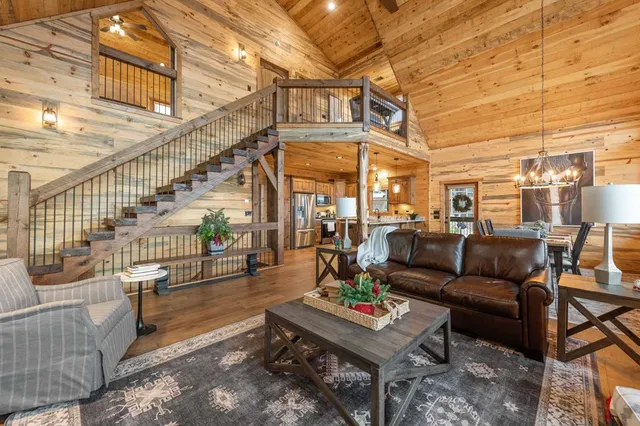 a living room with furniture and a table