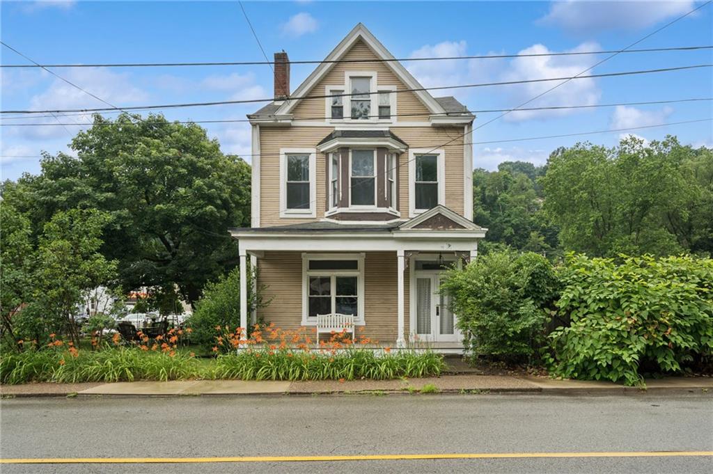 1523 Evergreen Road Pittsburgh, PA 15209 - Photo 1 of 35 a front view of a house with a garden