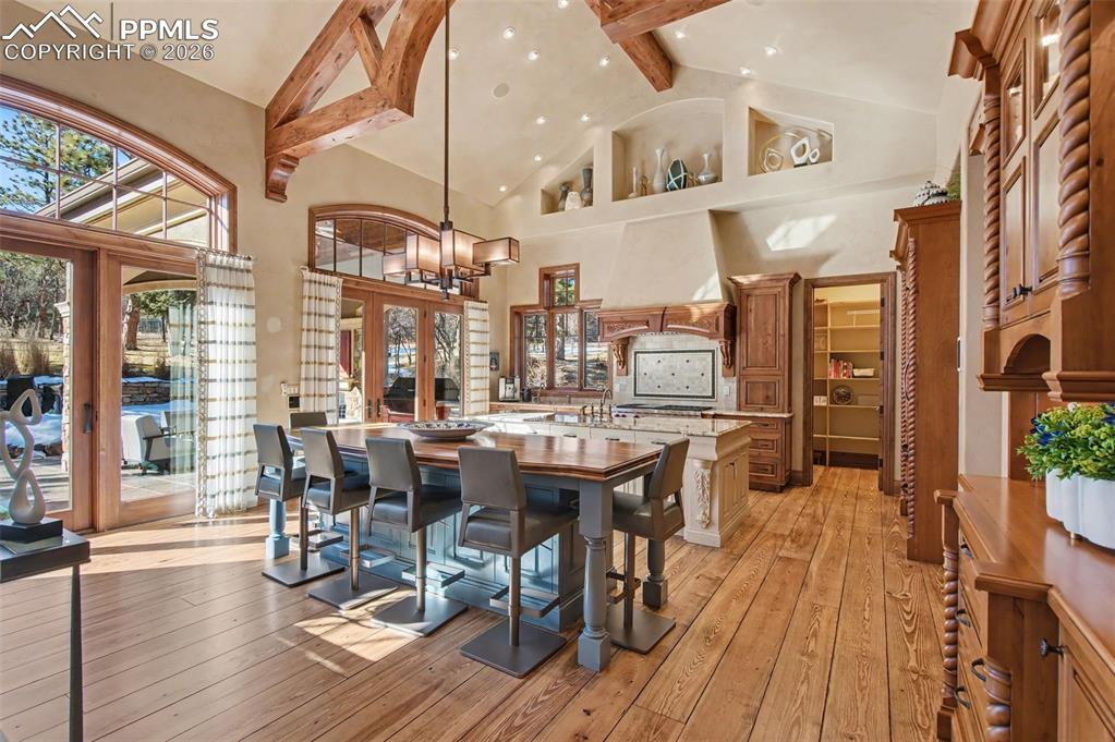 1830 Brantfeather Grove Colorado Springs, CO 80906 - Photo 11 of 50 a view of a dining room with furniture window and wooden floor