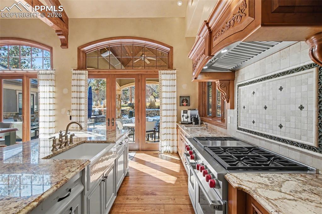 1830 Brantfeather Grove Colorado Springs, CO 80906 - Photo 18 of 50 a kitchen with stainless steel appliances granite countertop a stove and a sink