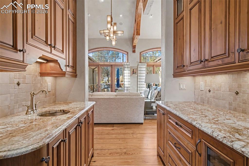 1830 Brantfeather Grove Colorado Springs, CO 80906 - Photo 21 of 50 a kitchen with granite countertop a sink and a stove