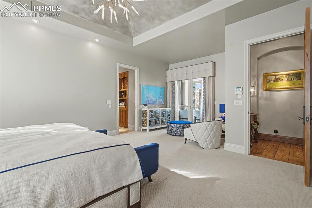 1830 Brantfeather Grove Colorado Springs, CO 80906 - Photo 26 of 50 a living room with furniture and a chandelier
