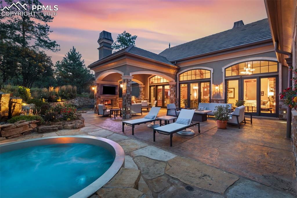 1830 Brantfeather Grove Colorado Springs, CO 80906 - Photo 4 of 50 a view of swimming pool with outdoor seating