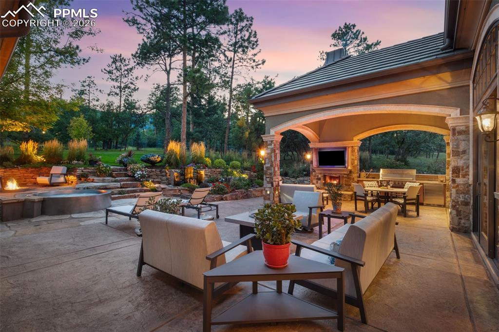 1830 Brantfeather Grove Colorado Springs, CO 80906 - Photo 49 of 50 a view of a patio with a dining table and chairs