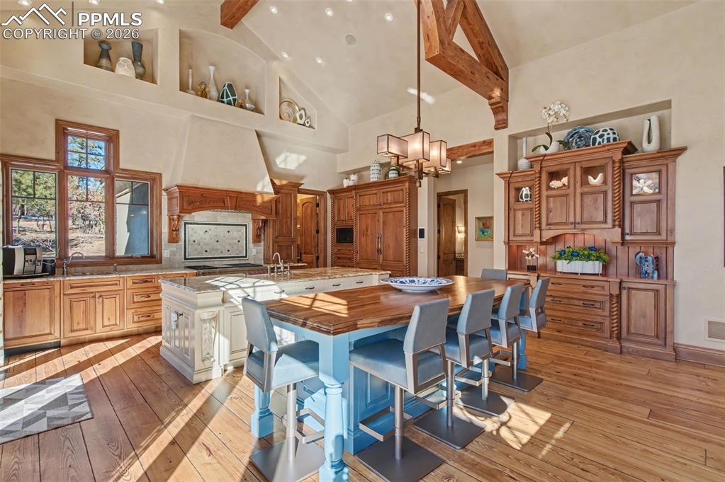 1830 Brantfeather Grove Colorado Springs, CO 80906 - Photo 10 of 50 a view of a dining room with furniture and wooden floor