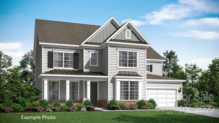 4010 Charlton Road, Unit 228 Fort Mill, SC 29715 - Photo 3 of 26 a front view of a house with a yard