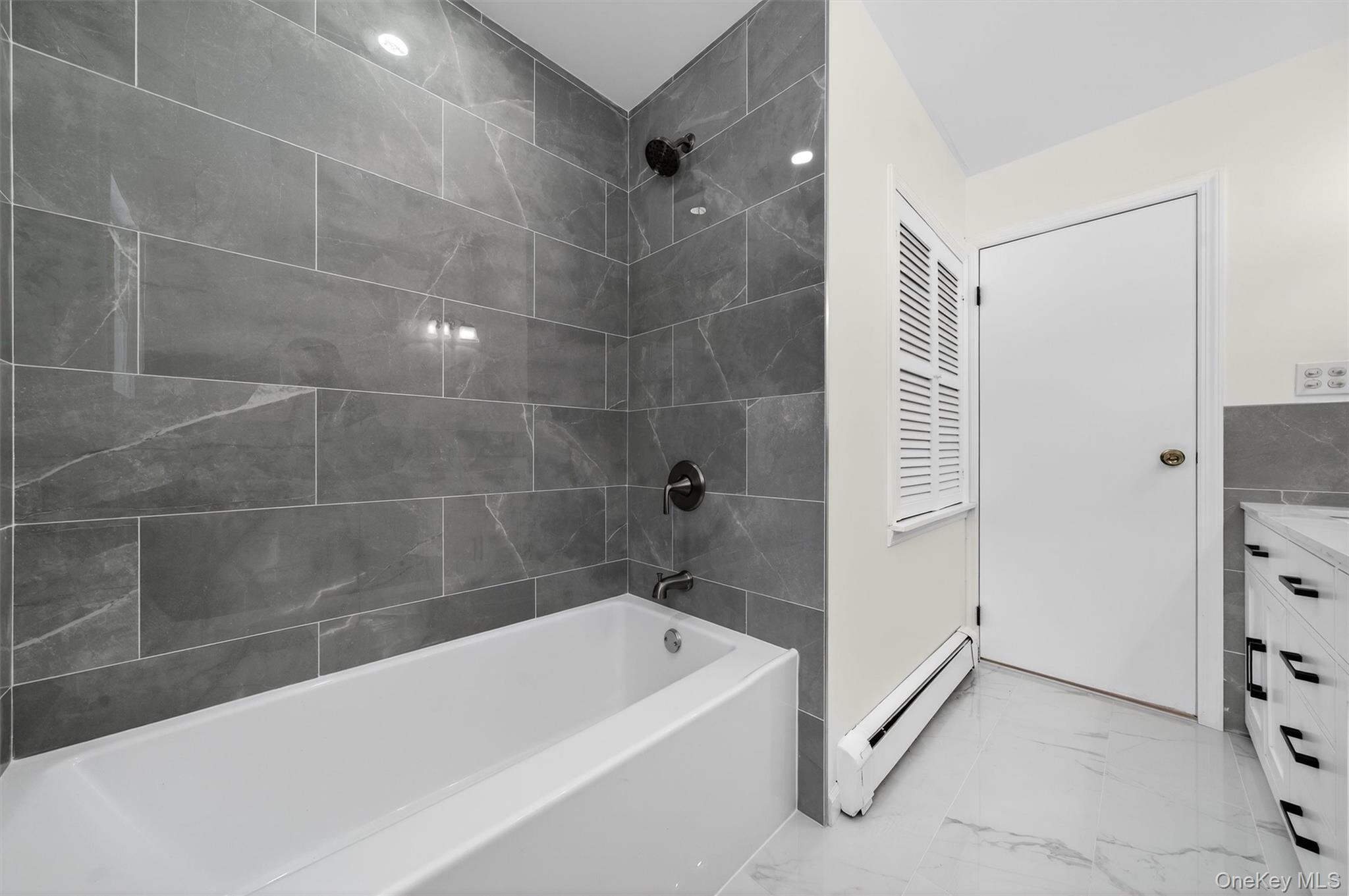 420 South Plank Road Westtown, NY 10998 - Photo 16 of 26 a bathroom with a bathtub and a shower