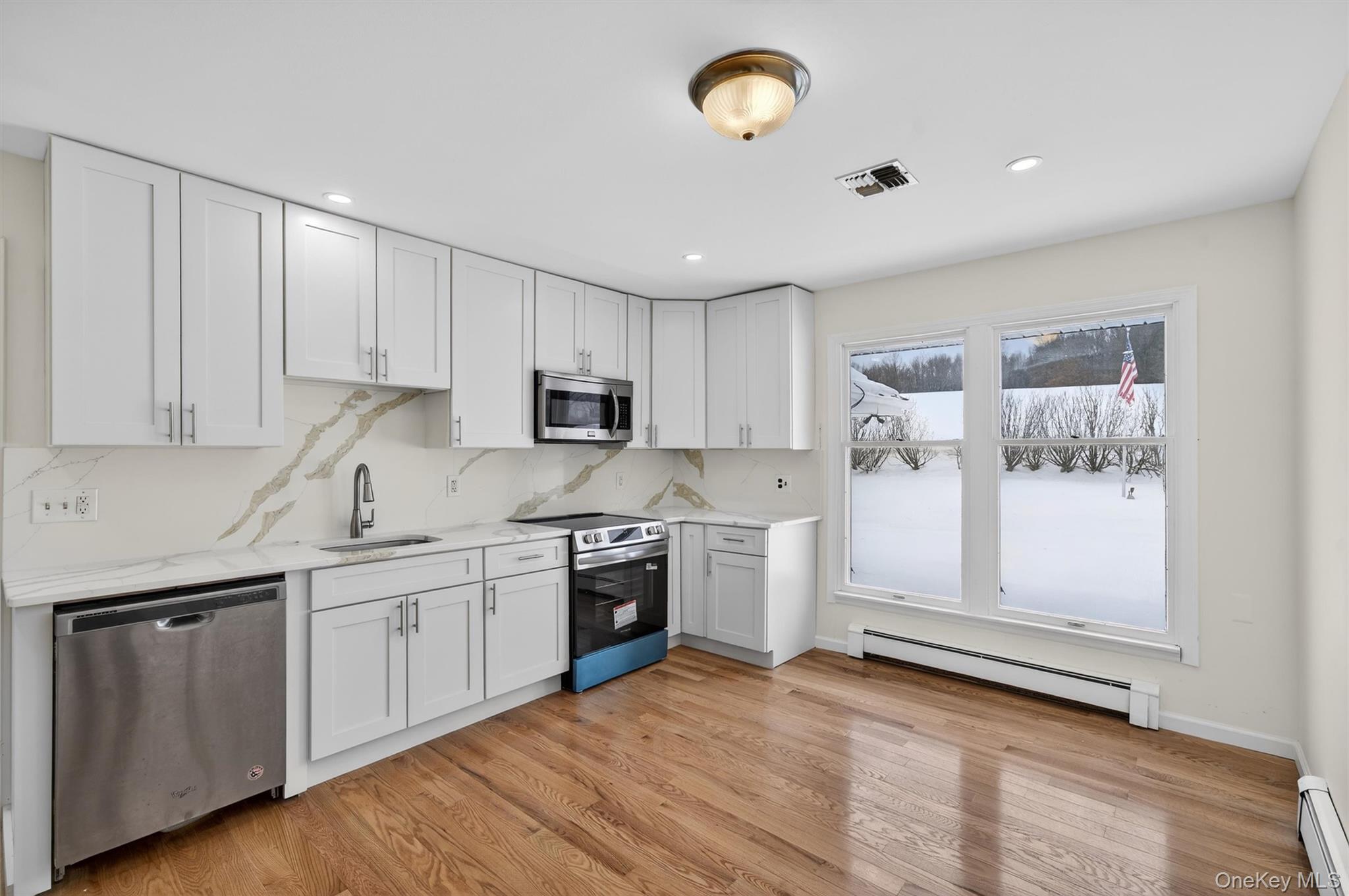 420 South Plank Road Westtown, NY 10998 - Photo 3 of 26 a kitchen with stainless steel appliances granite countertop a stove a sink and a refrigerator