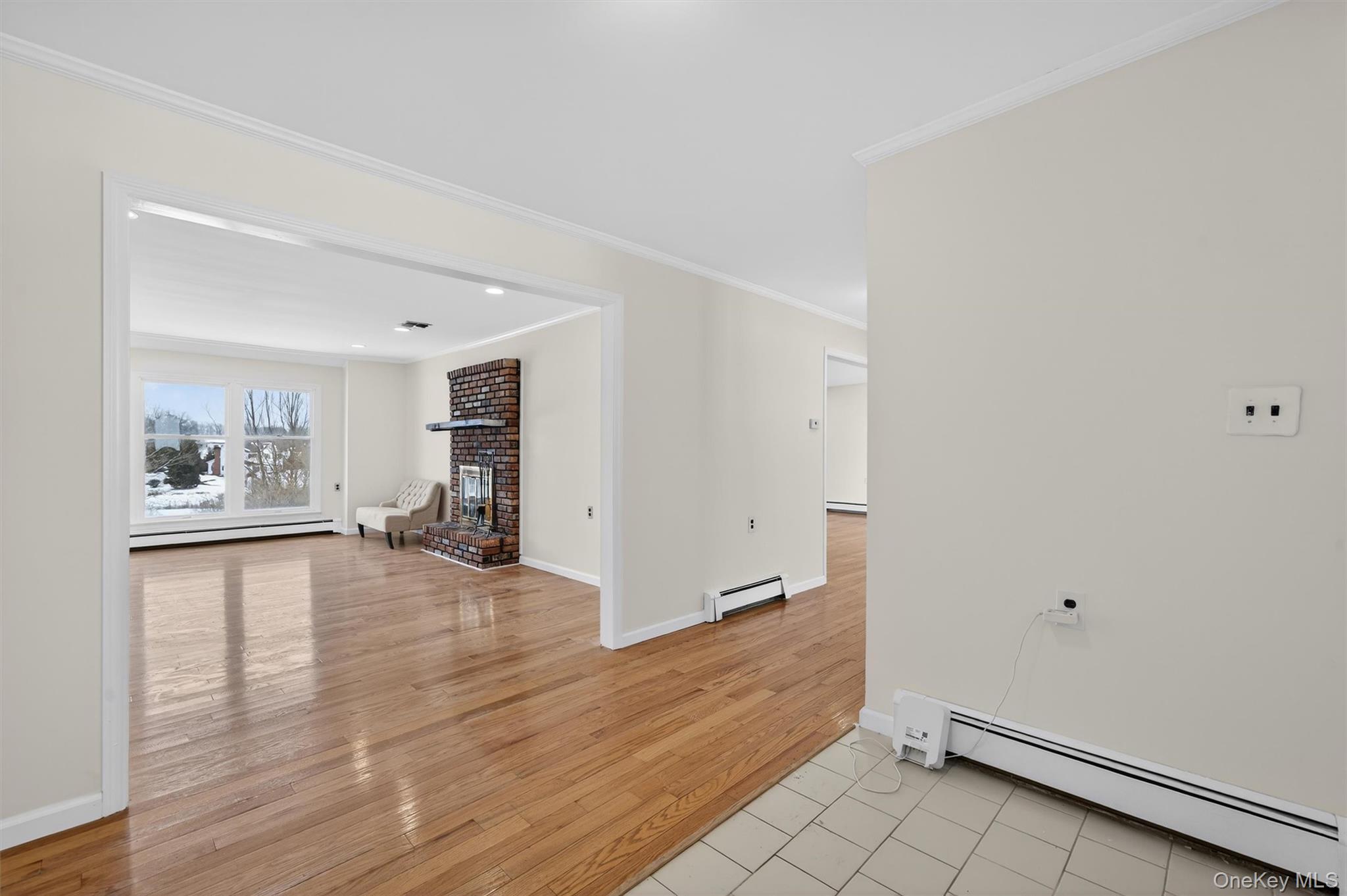 420 South Plank Road Westtown, NY 10998 - Photo 6 of 26 an empty room with wooden floor and window