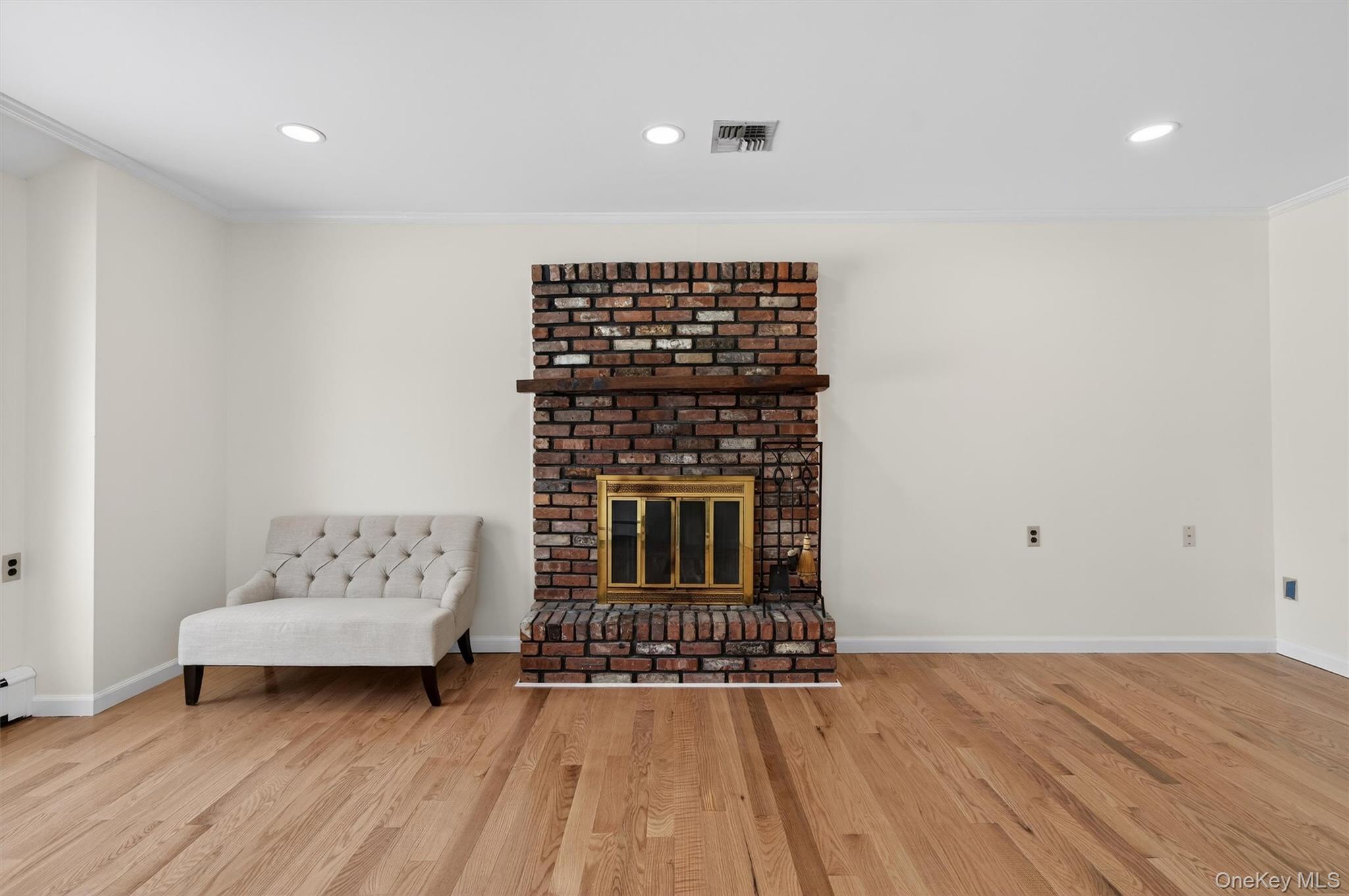 420 South Plank Road Westtown, NY 10998 - Photo 8 of 26 a living room with a rug and a wooden floor