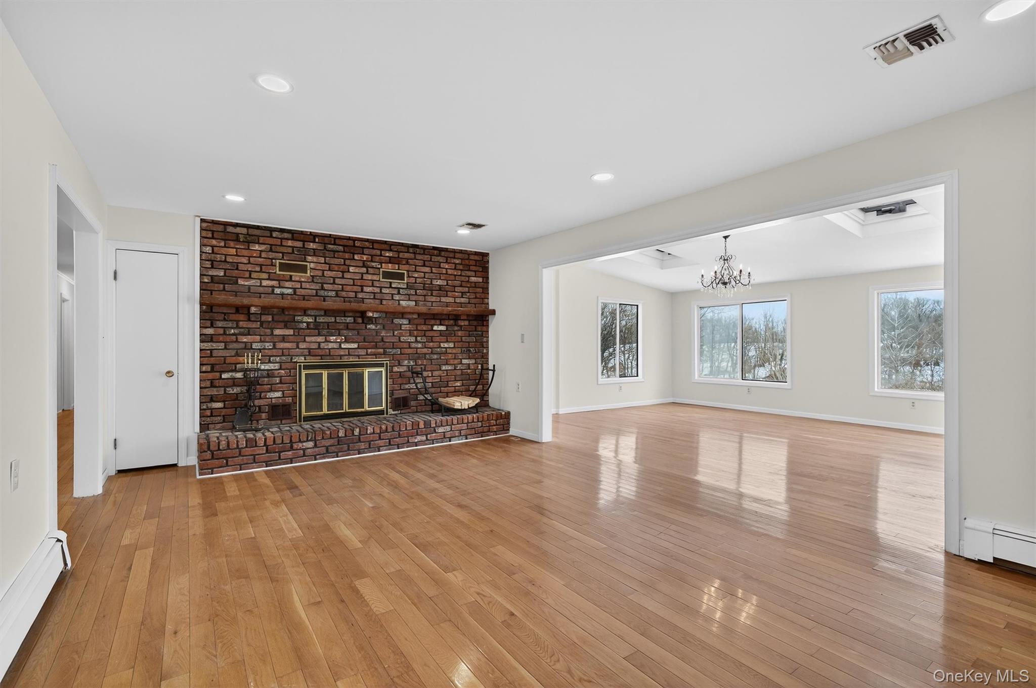 420 South Plank Road Westtown, NY 10998 - Photo 9 of 26 a view of an empty room with wooden floor and a window