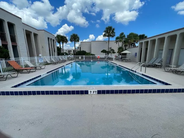 a swimming pool view with a outdoor space