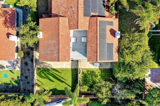 an aerial view of house with yard