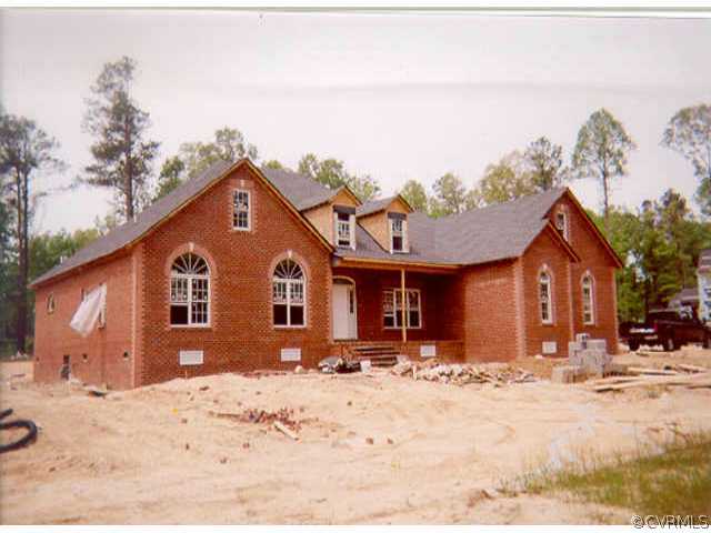4512 Chippoke Road Chester, VA 23831 - Photo 1 of 1 a front view of a house with a yard covered in snow