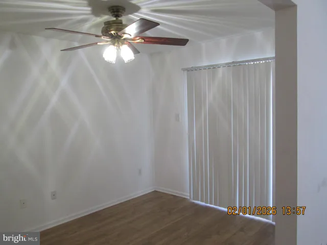 a view of a chandelier fan in a room