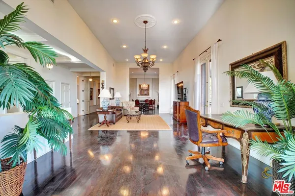 a view of a living room and entryway