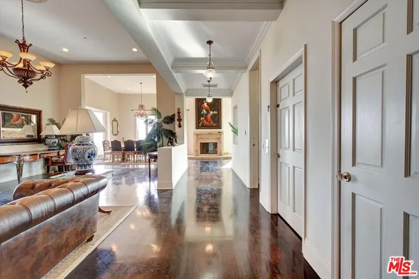 a living room with furniture or wooden floor and a chandelier