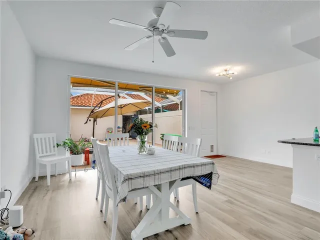 a view of dining room with furniture and wooden floor