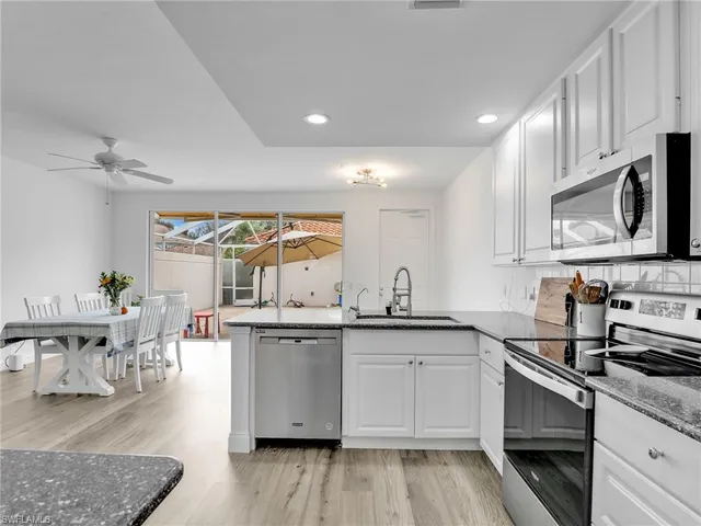 a kitchen with lots of counter top space and appliances