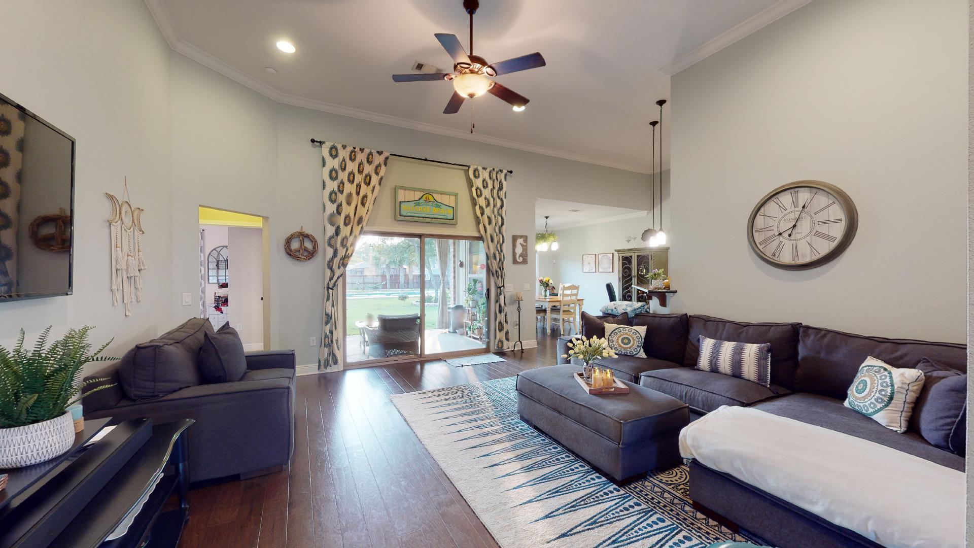 1959 Commodore Drive Navarre, FL 32566 - Photo 11 of 56 a living room with furniture a clock on wall and a window