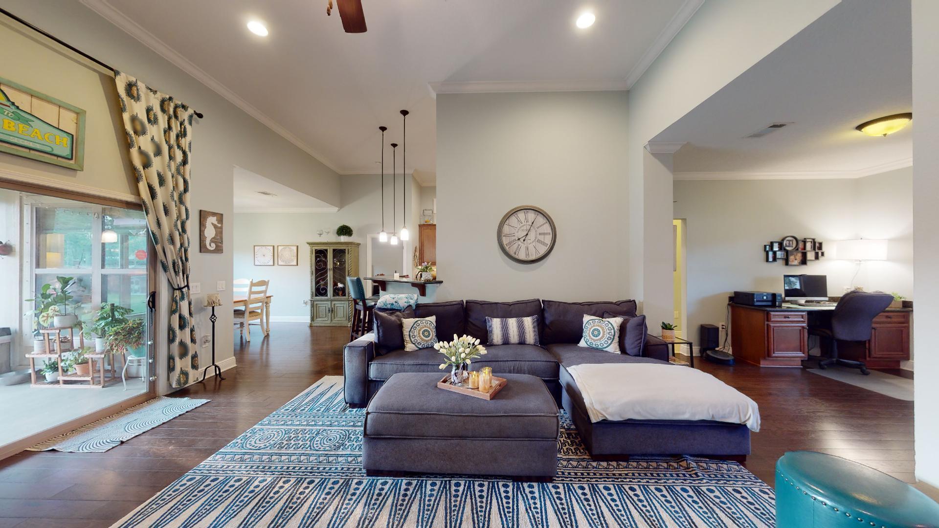 1959 Commodore Drive Navarre, FL 32566 - Photo 12 of 56 a living room with furniture and a rug