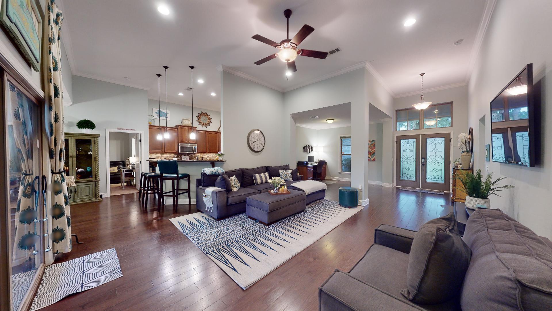 1959 Commodore Drive Navarre, FL 32566 - Photo 13 of 56 a living room with furniture and a large window