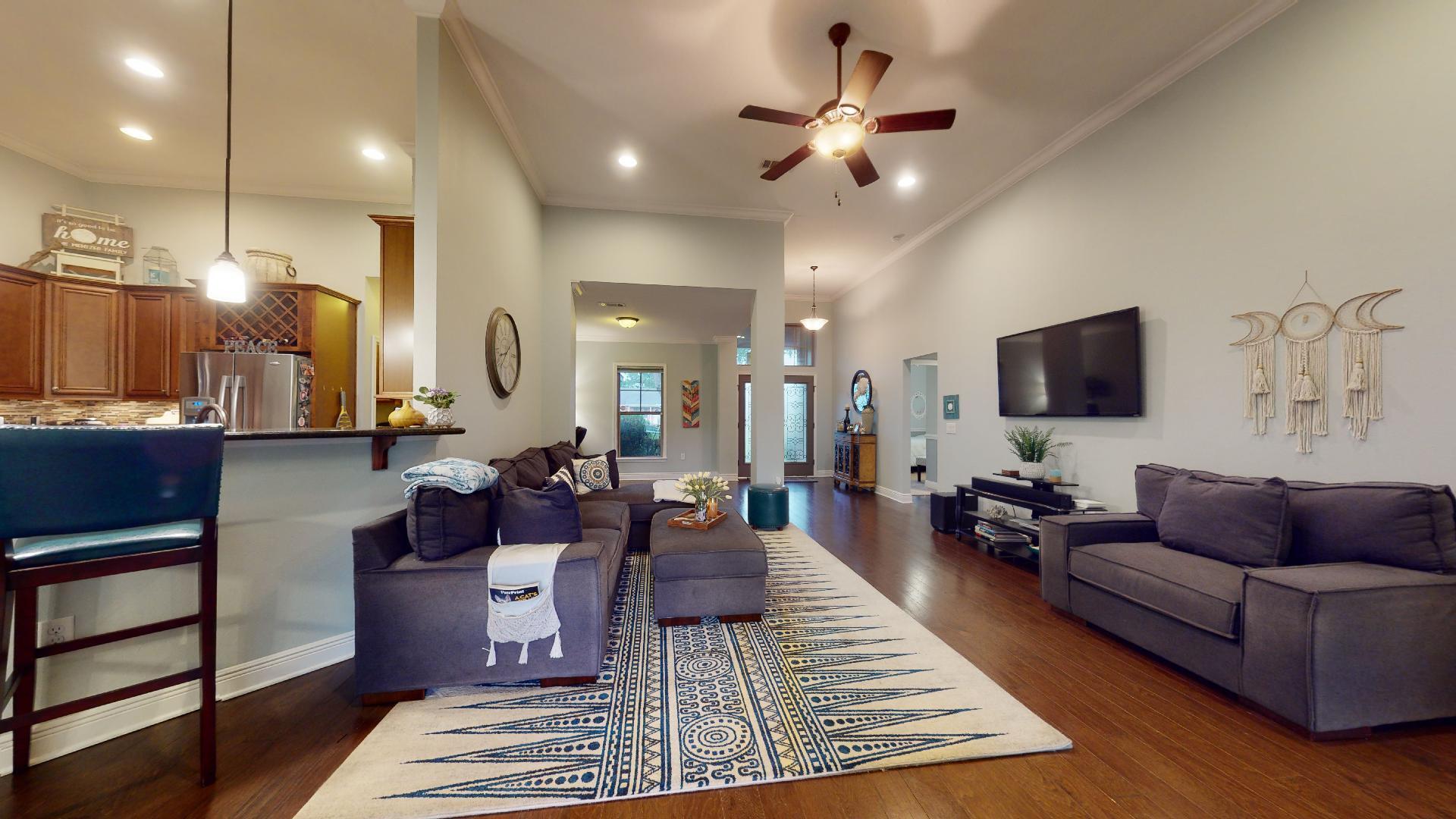 1959 Commodore Drive Navarre, FL 32566 - Photo 14 of 56 a living room with furniture and a flat screen tv
