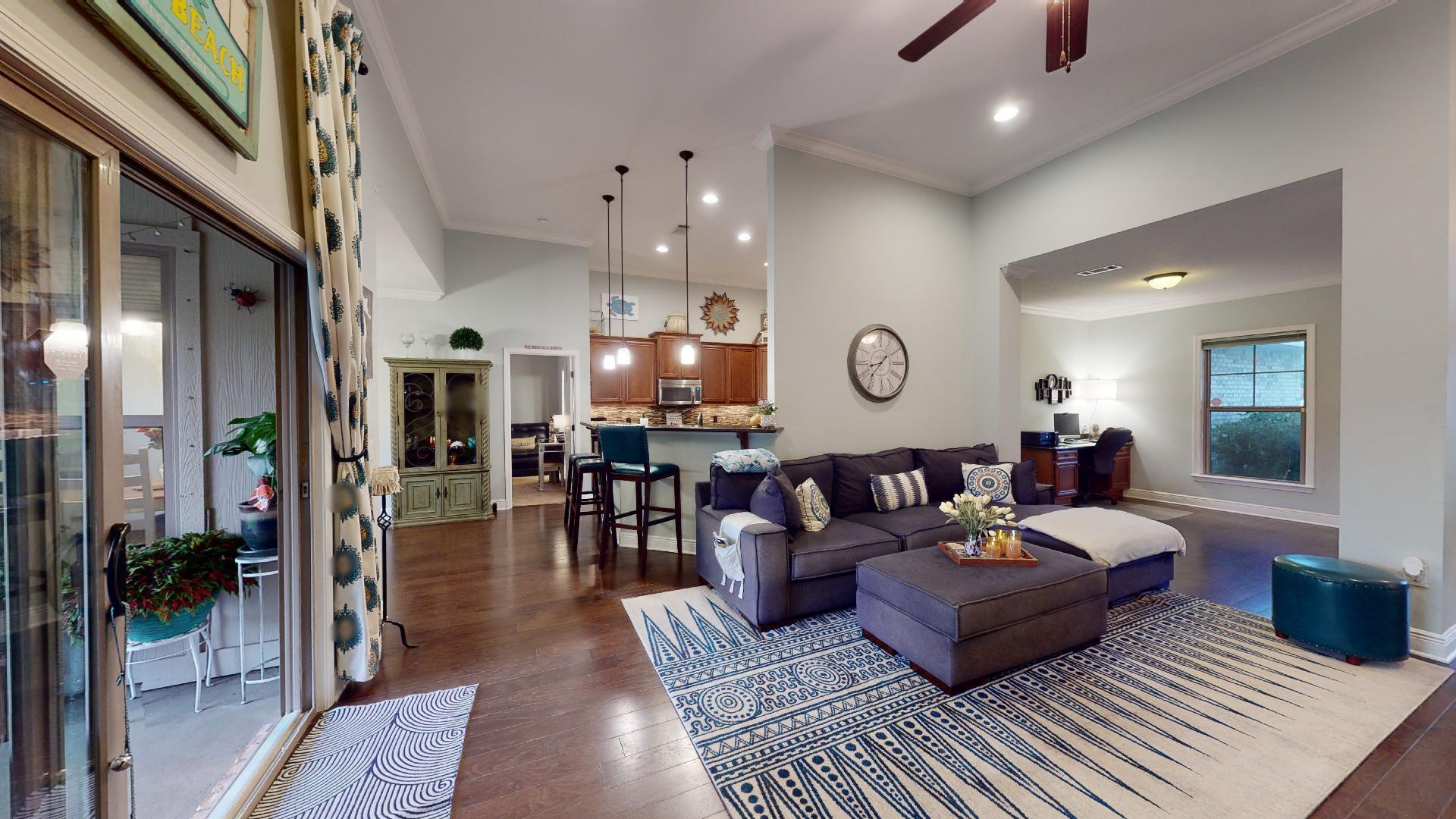 1959 Commodore Drive Navarre, FL 32566 - Photo 16 of 56 a living room with furniture and a large window