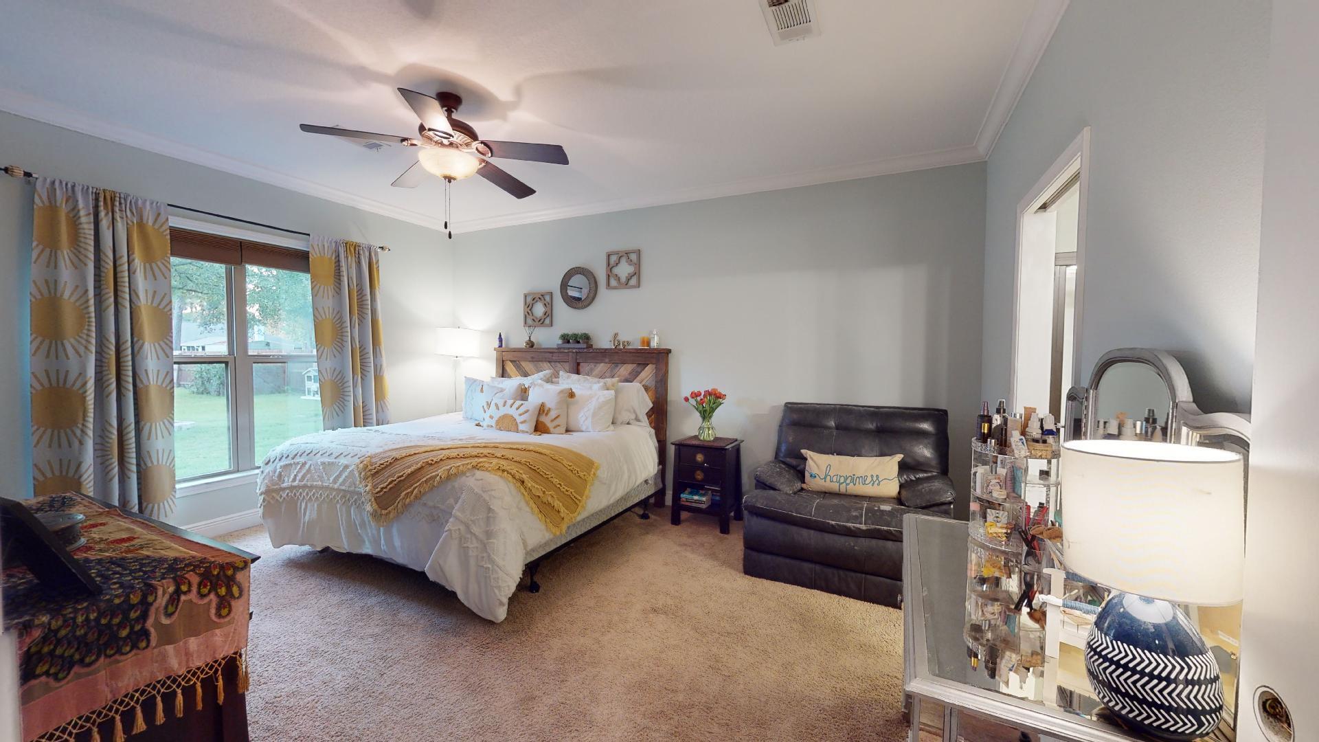 1959 Commodore Drive Navarre, FL 32566 - Photo 24 of 56 a bedroom with a bed and a couch